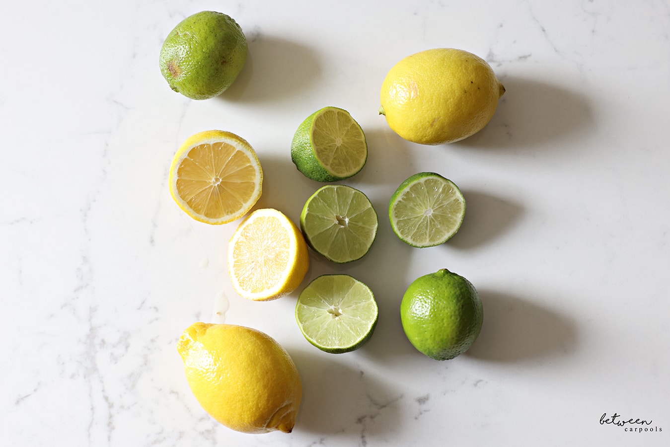 lemons and limes, some sliced in half