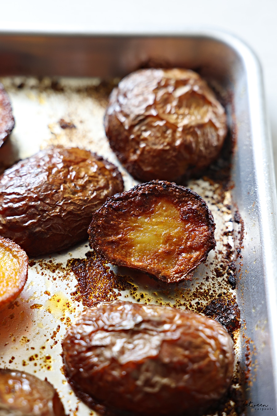 baked potatoes on a metal sheet pan