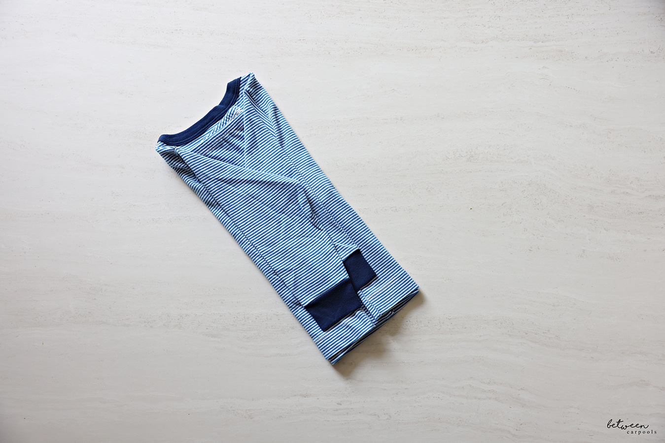 The left sleeve of the pajama top folded inward.
