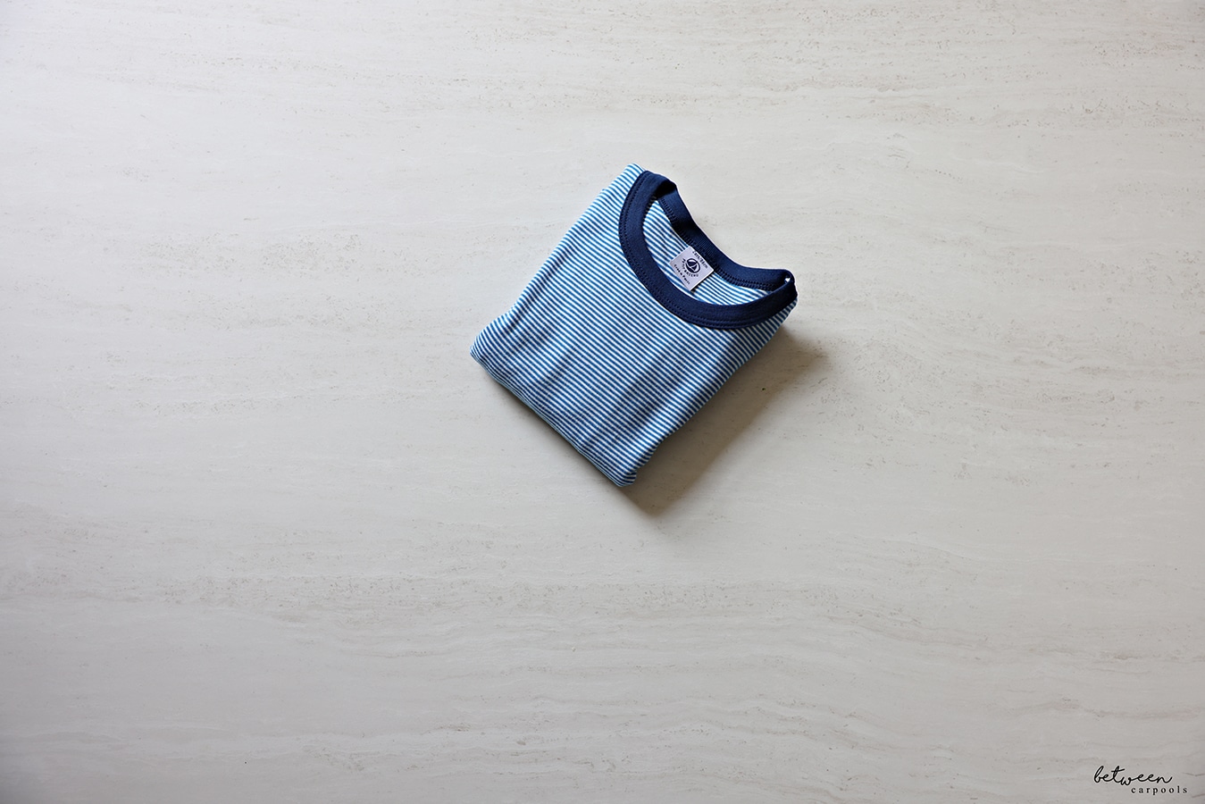 A pair of pajamas folded as one piece.