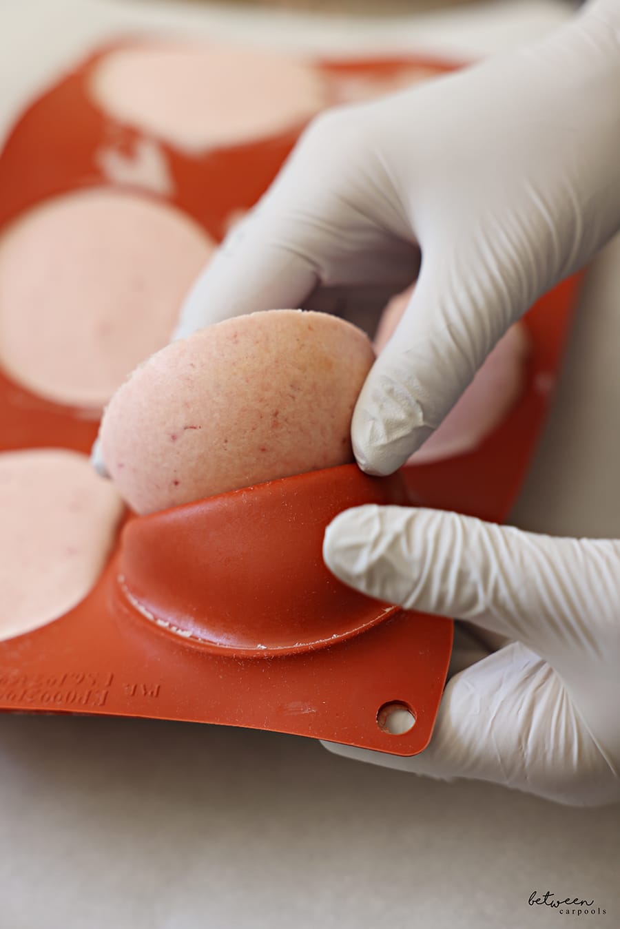 Removing ice cream from their silicone molds