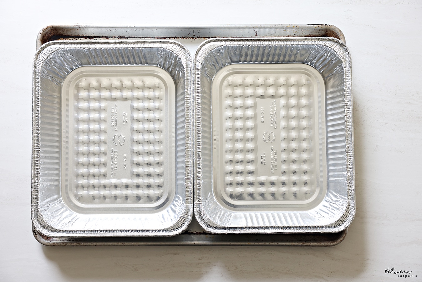 two 9 x 13 pans side by side on a big metal sheet pan