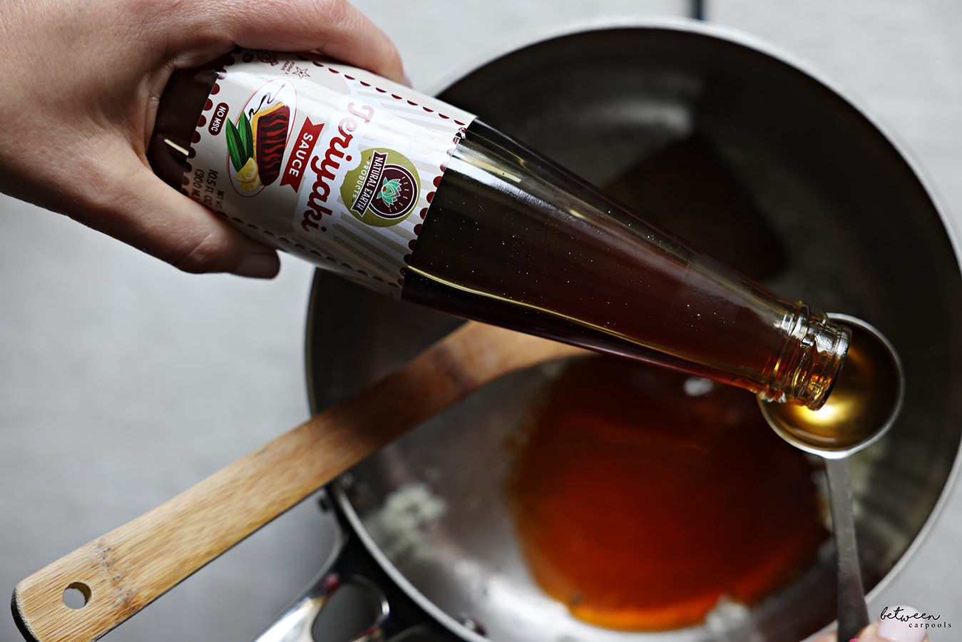 Making the glaze for the wings with teriyaki sauce.