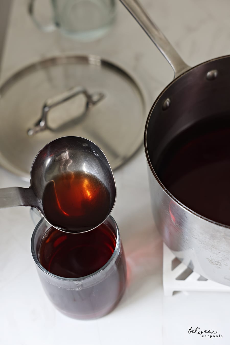 Ladling into a glass mug.