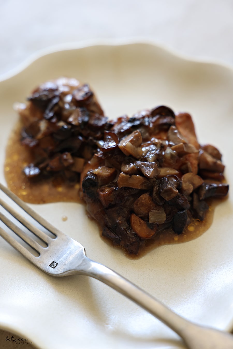 Plated mushroom braised chicken.