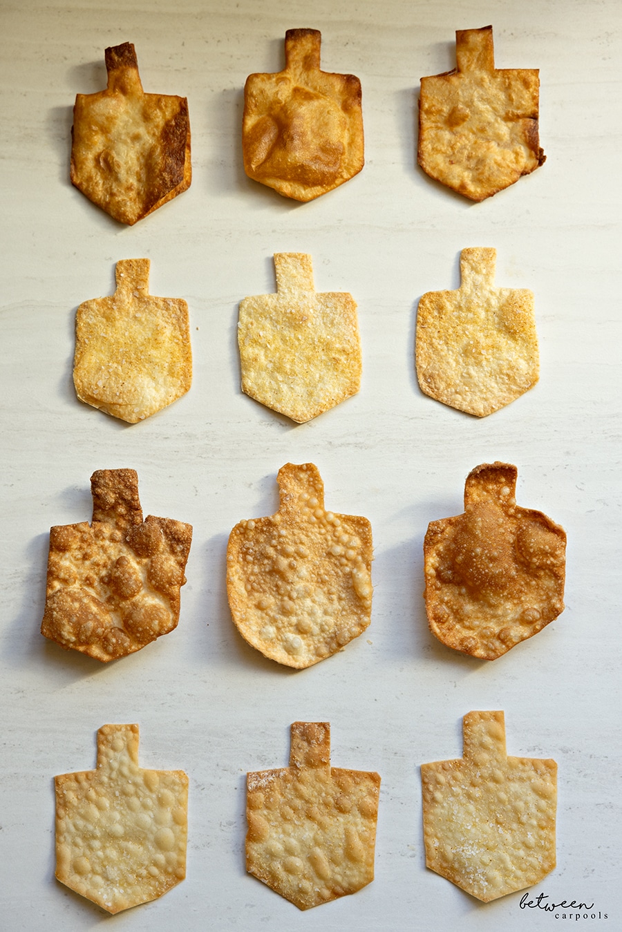 Fried and baked dreidel shape tortilla wraps and wonton wrappers.