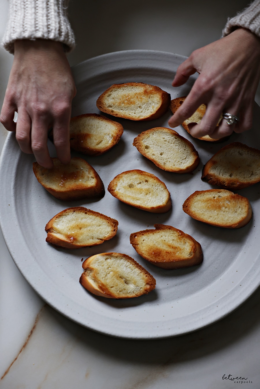 Brruschetta - toasted baguette slices - on a plate.