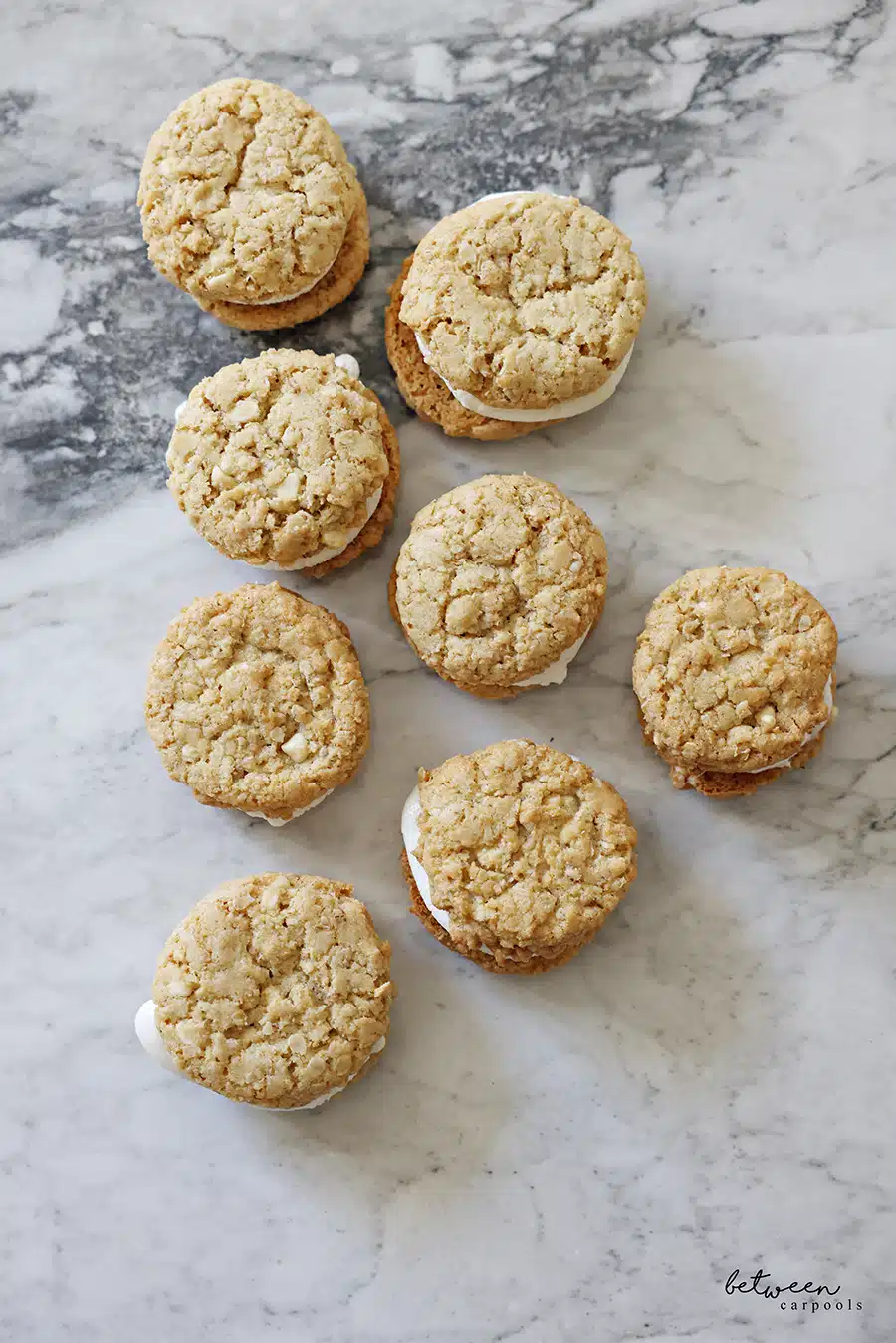 Toasted Marshmallow Sandwich Cookies on stone - overhead view