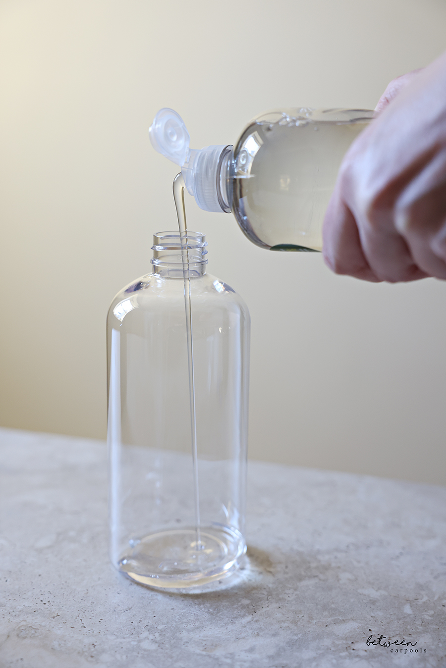 Filling a Clear Soap Dispenser with Palmolive Ultra Pure + Clear Liquid Dish Soap Detergent - Fragrance Free.