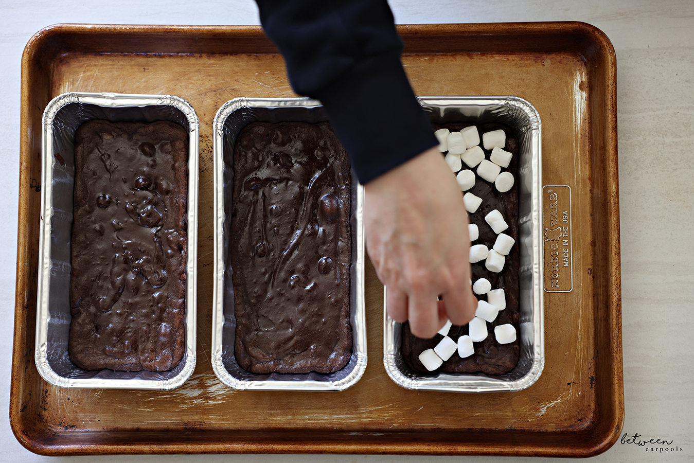 Topping chocolate batter in three greased 2 lb loaf pans, baked partially, until the edges are set, with mini marshmallows.