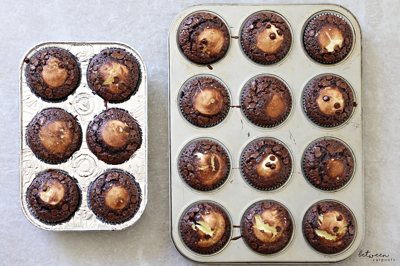 Baked chocolate cheese muffins in pans.