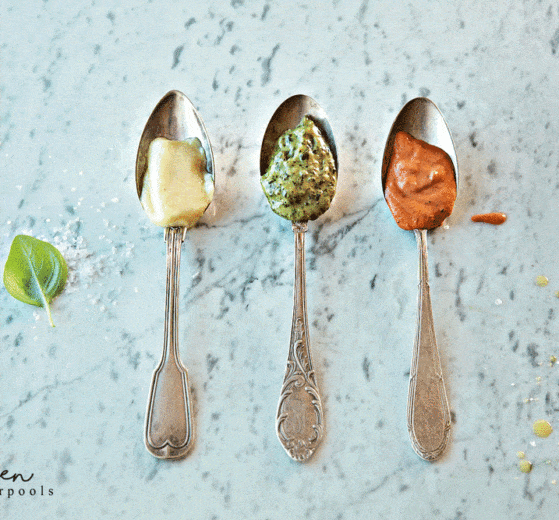 3 silver spoons, each with a pasta sauce: Penne a la Vodka, Pesto Cream Pasta Sauce and Alfredo Sauce