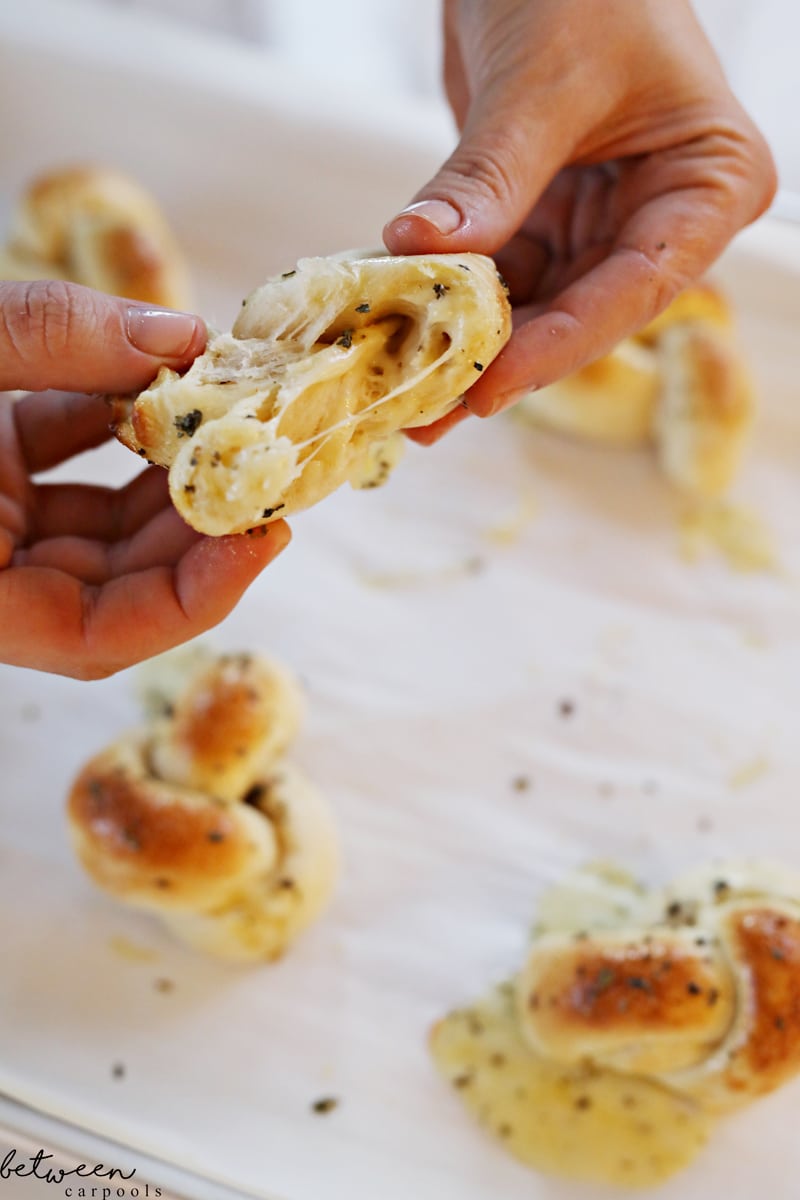 Garlic Twists These were the biggest hit of the day! Roll out small pieces of dough, 8 inches long and 3 inches wide. Place a strip of Natural and Kosher Garlic Herb Cheese on the strip. Seal it, pinching the edges together, to enclose the cheese inside the strip. Tie dough strip into a knot. Place on a baking sheet lined with parchment paper. Bake at 475-500ºF for 7-9 minutes or until edges golden. Immediately after removing from oven, brush on olive oil mixed with dried basil and garlic powder. That’s it! Eat while still hot. A cheesy garlic knot with flavor inside and out!