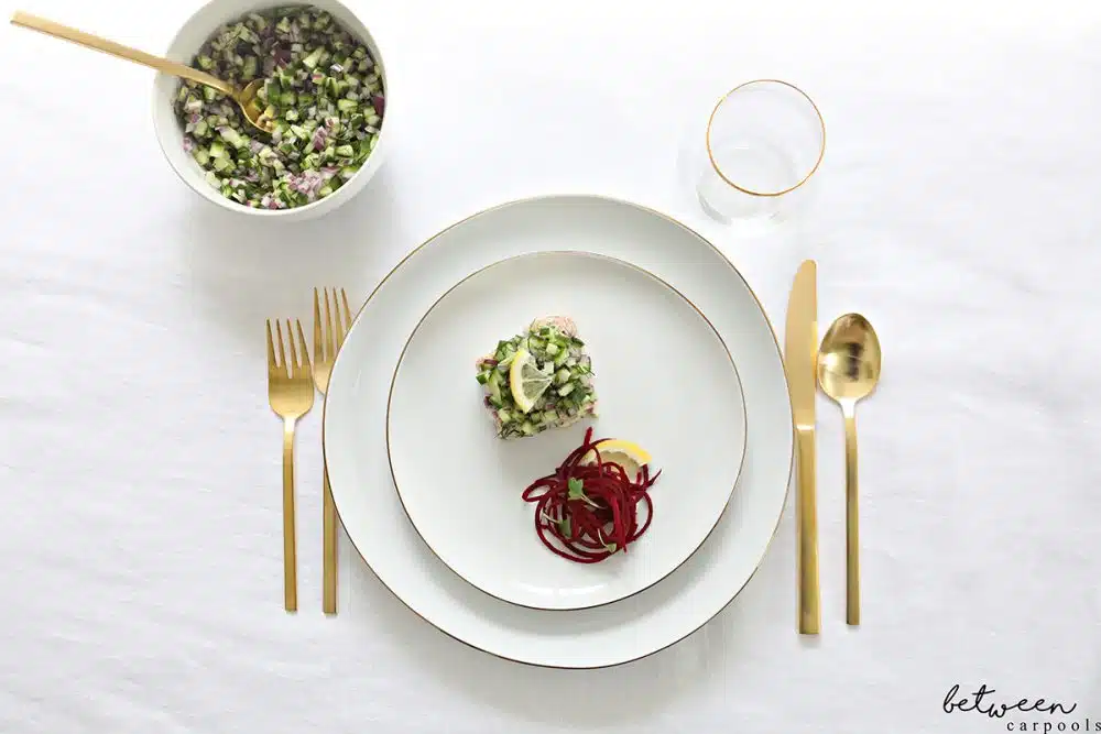 Plated lemon dill salmon with lemon and spiralized beets.