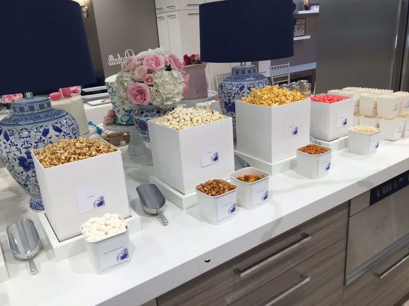 What’s the Newest Fun Idea for Your Party? A Popcorn Bar. Sure, there’s lots of desserts, donuts of course, and a salad bar and sushi bar. But the latest, most fun element of the sweet table is the Popcorn Bar.