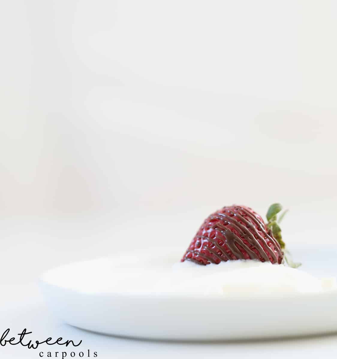 strawberry in whipped cream