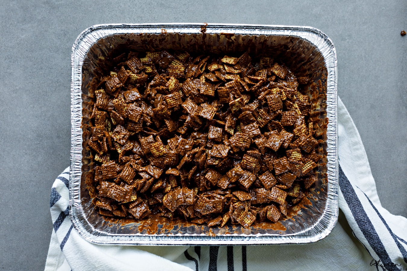 Combined muddy buddies in a 9x13 pan.