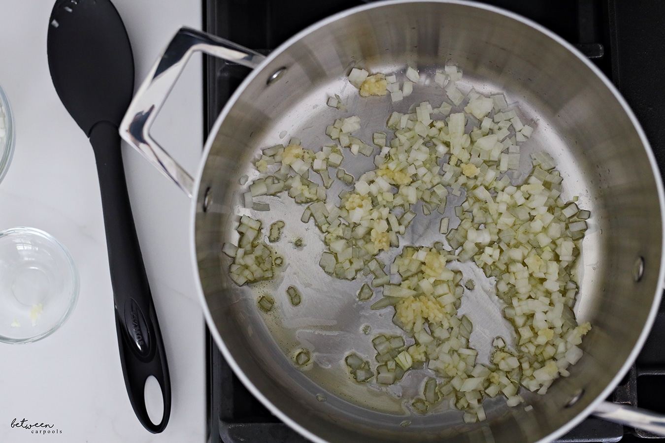 Sauté onion and garlic for spaghetti and meat sauce in one pot.