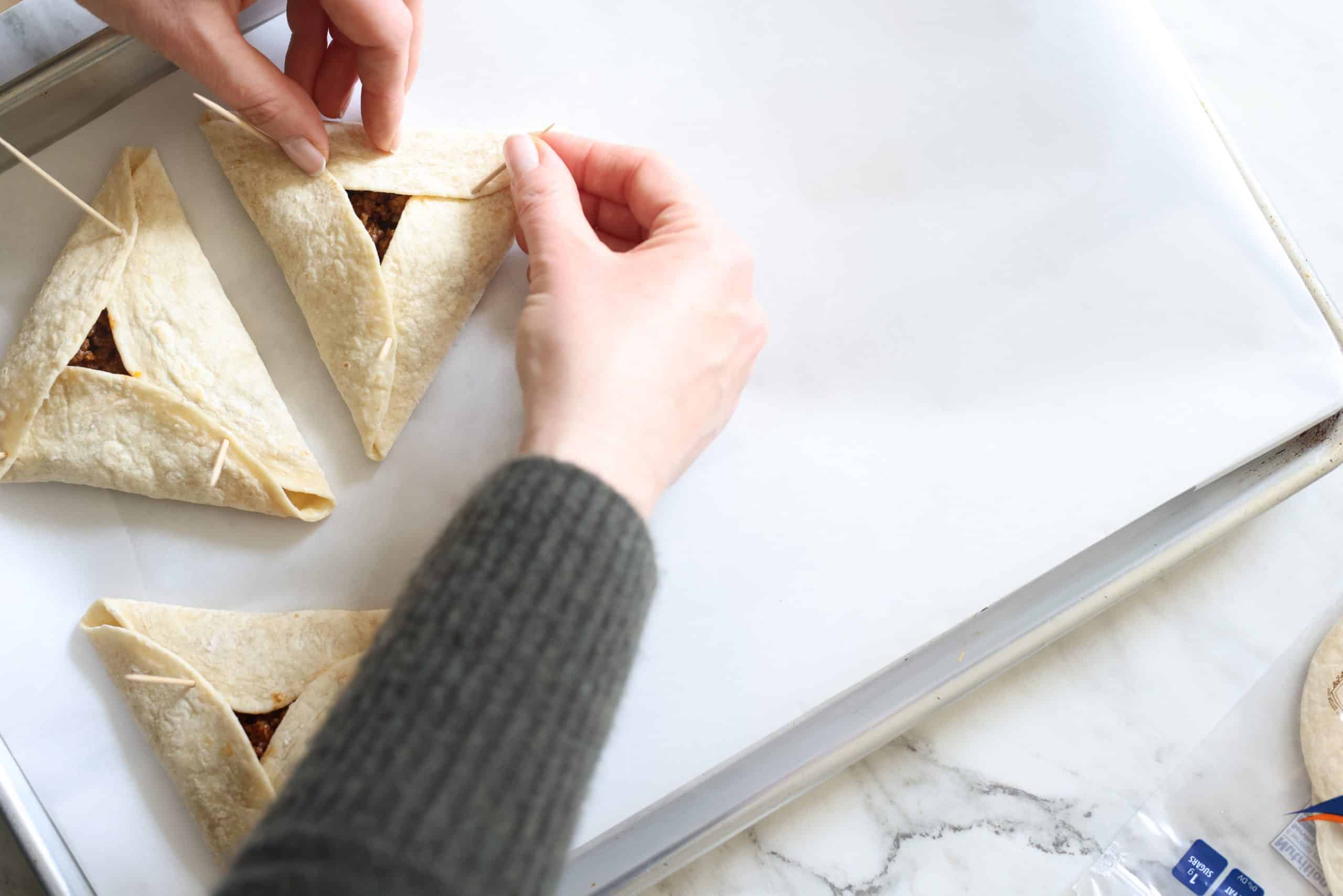 Then, fold over the bottom, to form a triangle. (meat hamantaschen)