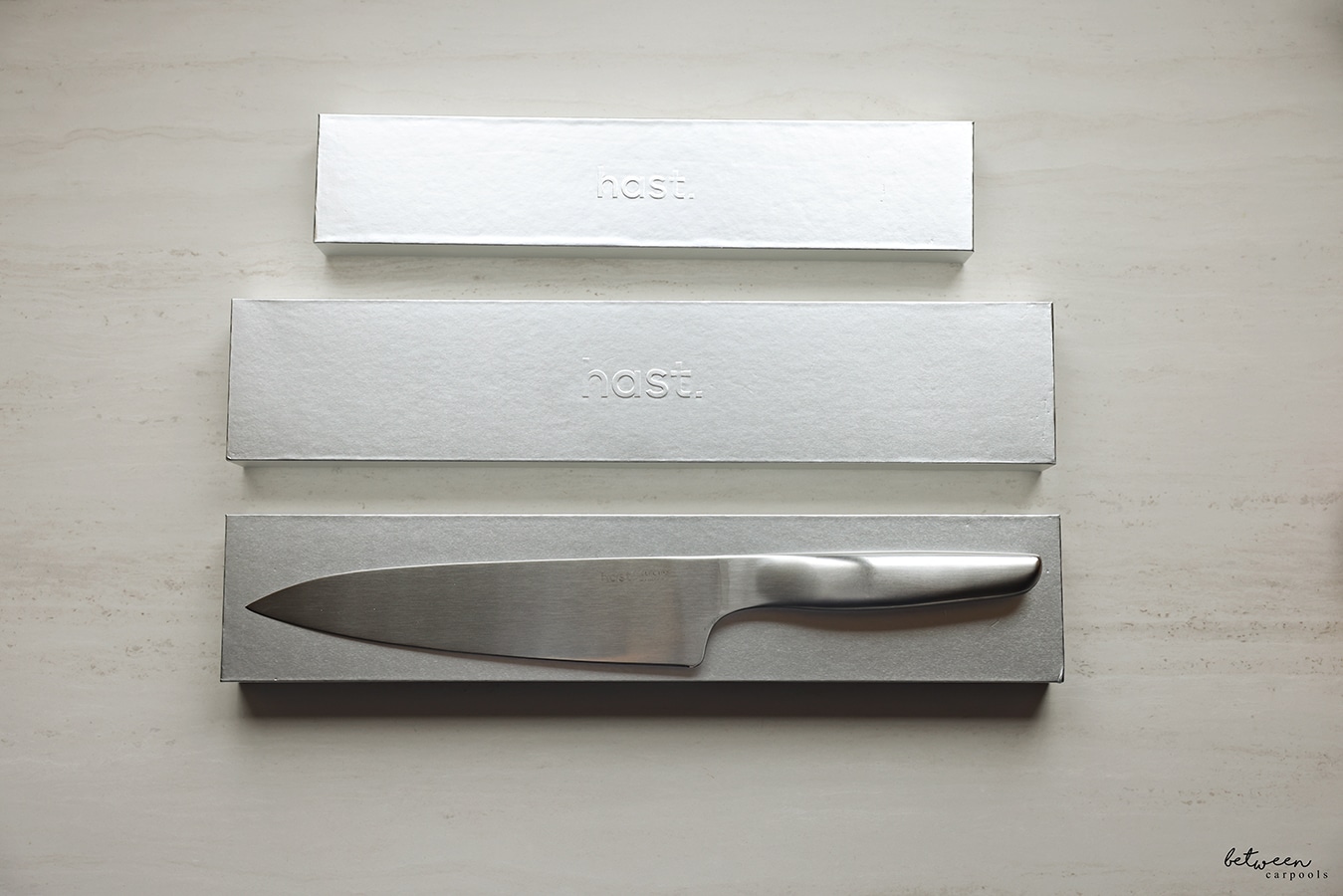 hast knives packaging - pairing knife in box, utility knife in box, and chef knife on its box