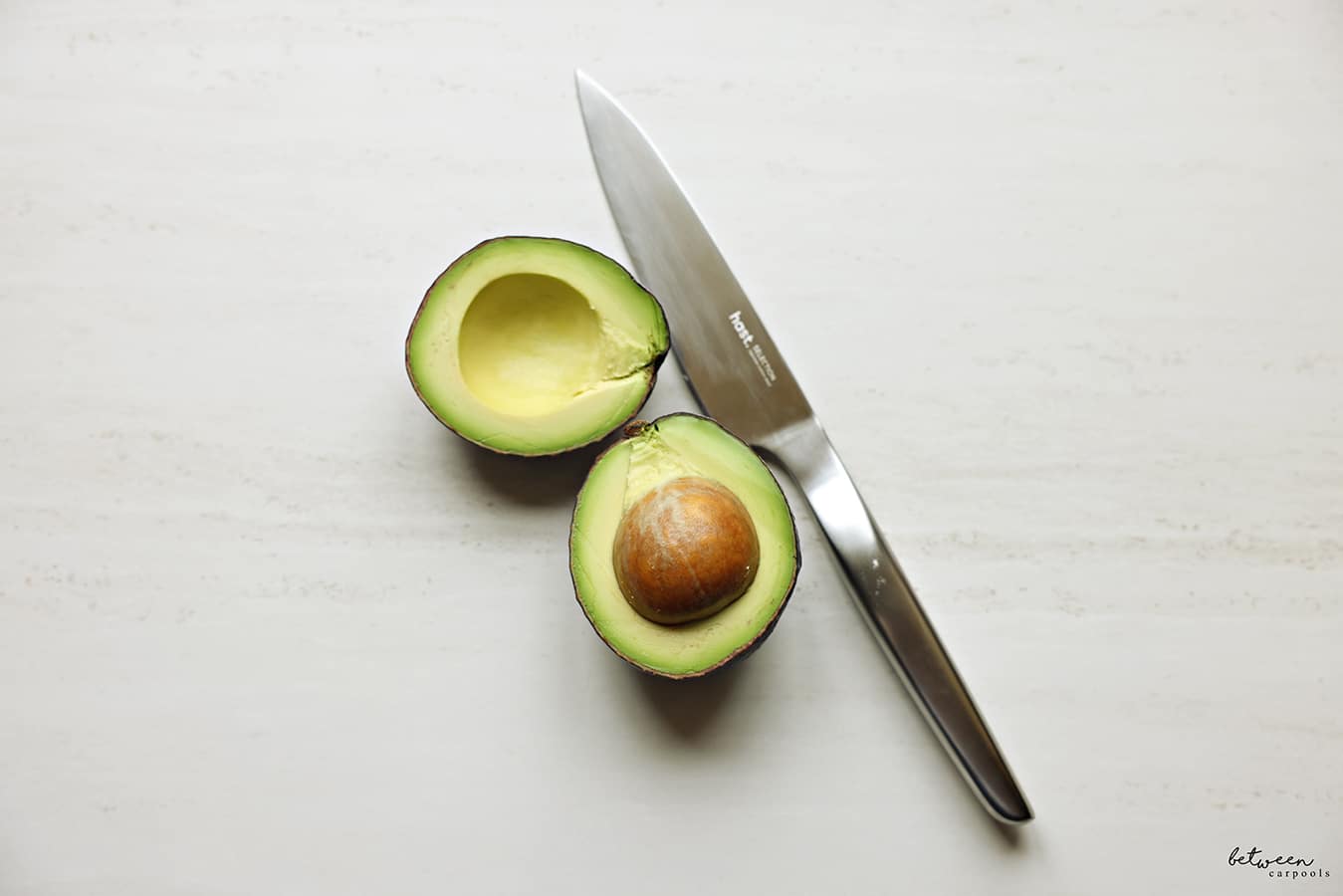 hast utility knife near an open avocado