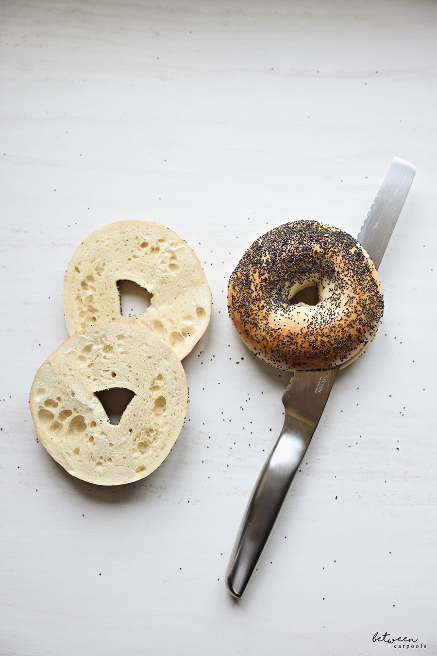 hast bread knife cutting through a bagel