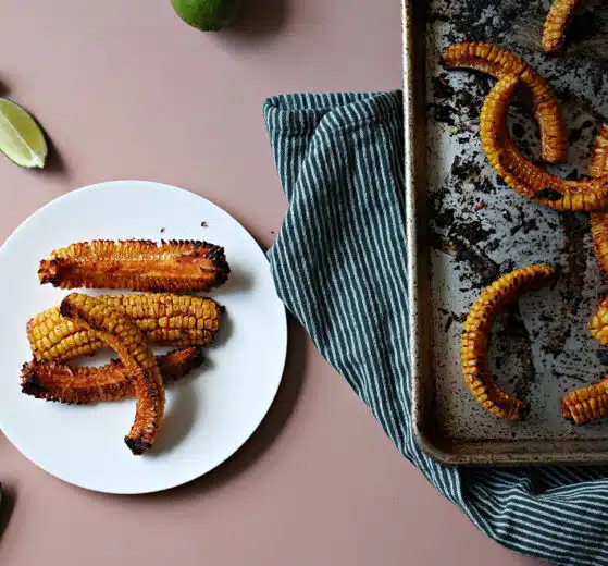 Roasted corn riblets on a baking sheet and plated.