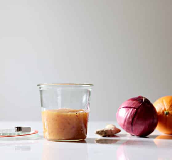 homemade duck sauce in a ball jar. ginger, a red onion and an orange