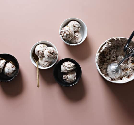 Babka ice cream in a carton and scoops of babka ice cream in ramekins
