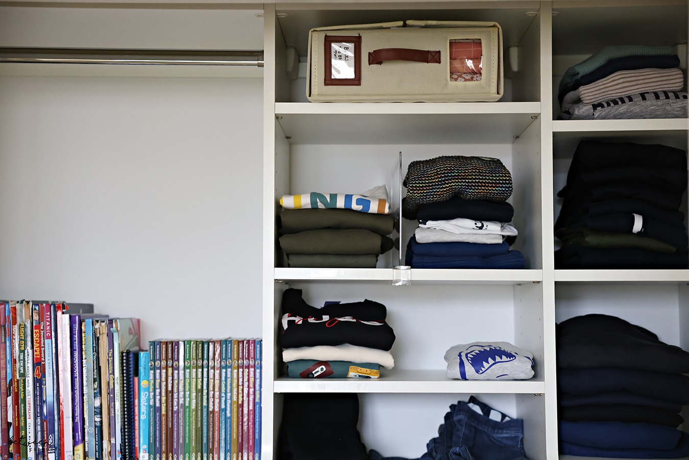 one bed sheet organizer on the top shelf of a bedroom closet
