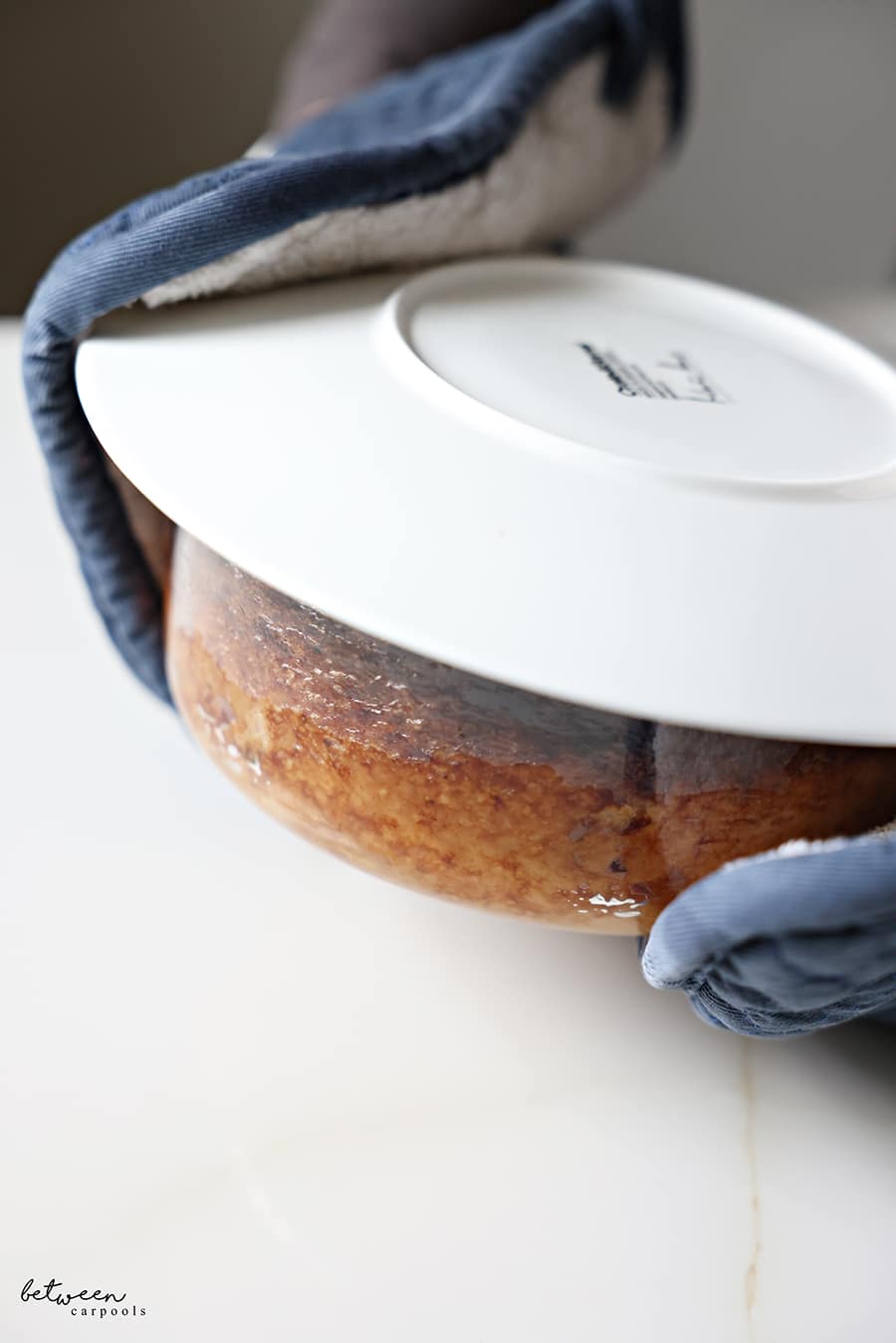 top the potato kugel in a round pyrex with a plat. ready to flip it