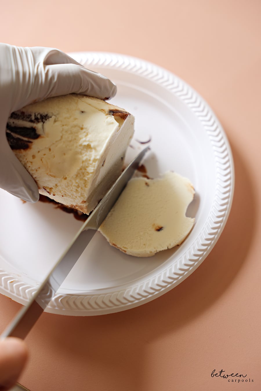 slicing the bottom of the ice cream pint