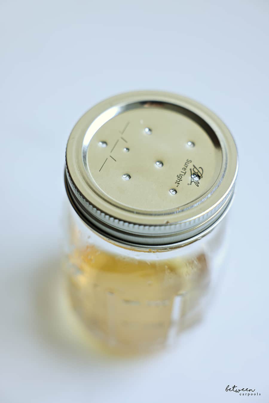 holes in the lid of a Ball jar
