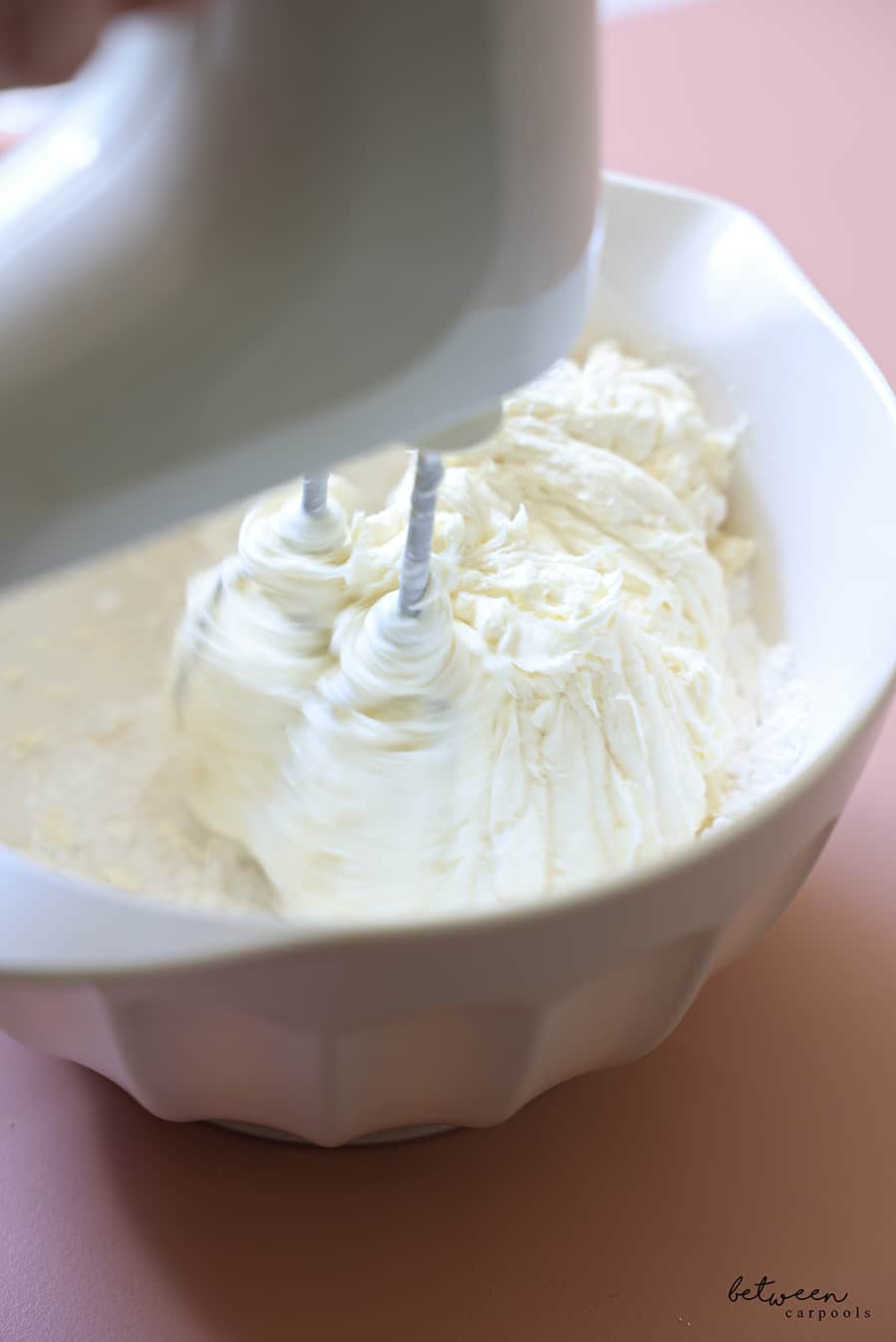 in a bowl with a hand mixer