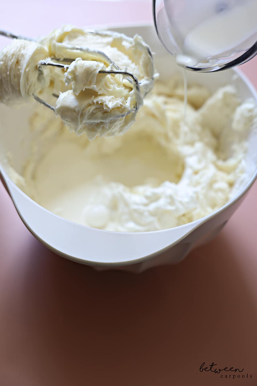 in a bowl with a hand mixer