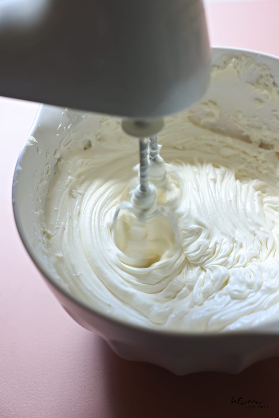 in a bowl with a hand mixer