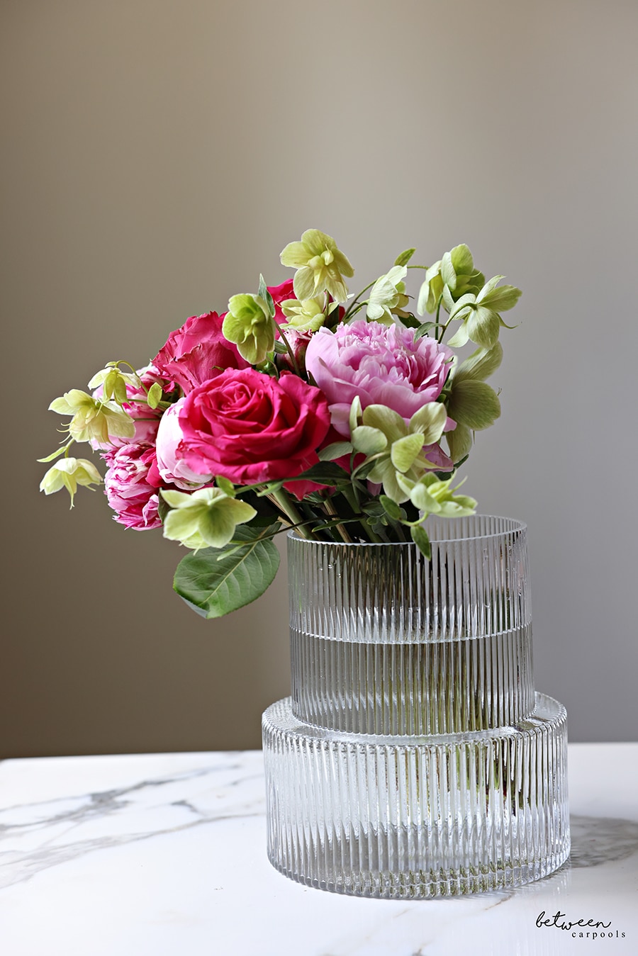 Flowers in a vase all falling to one side