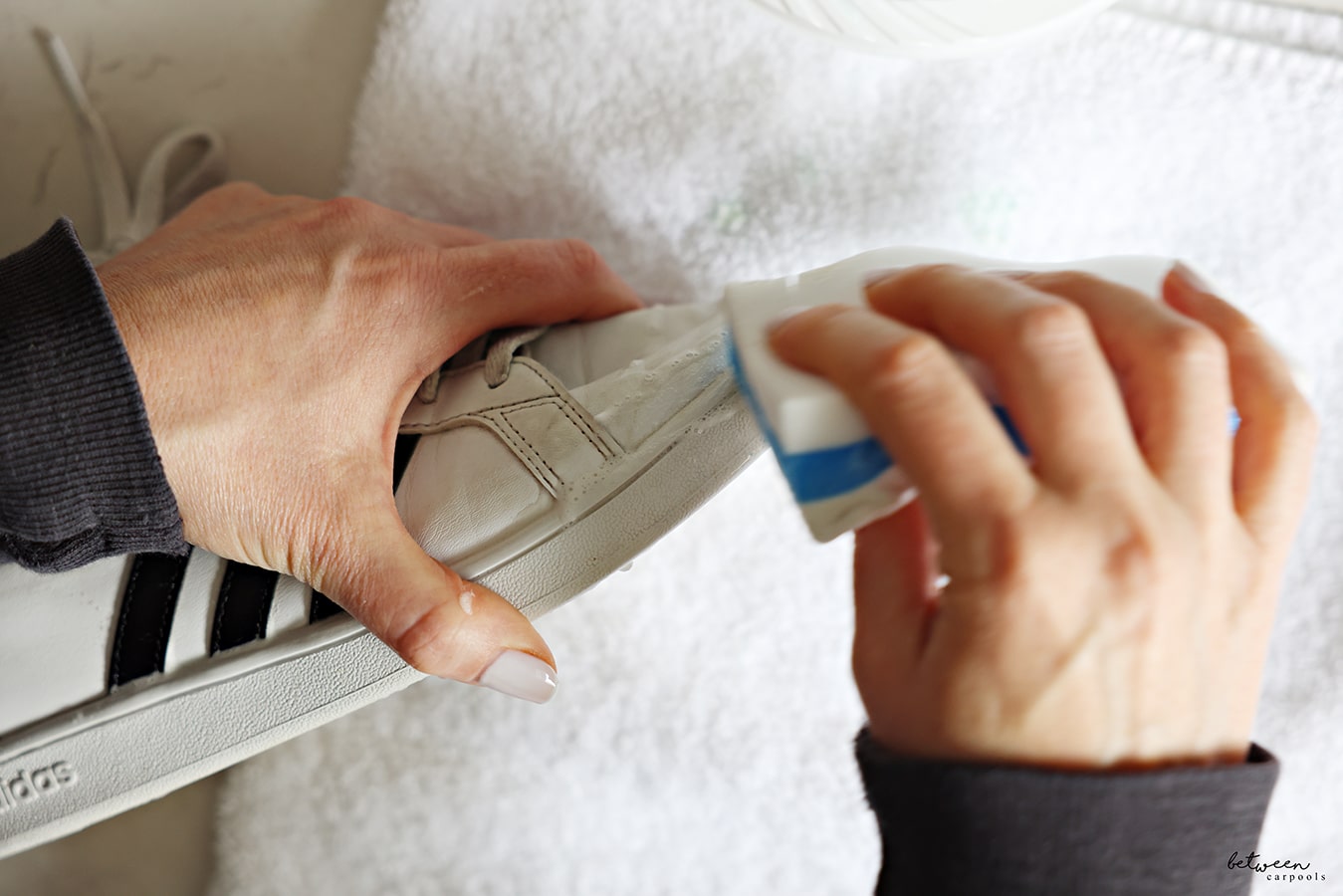 Using a magic eraser on adidas girls white sneaker
