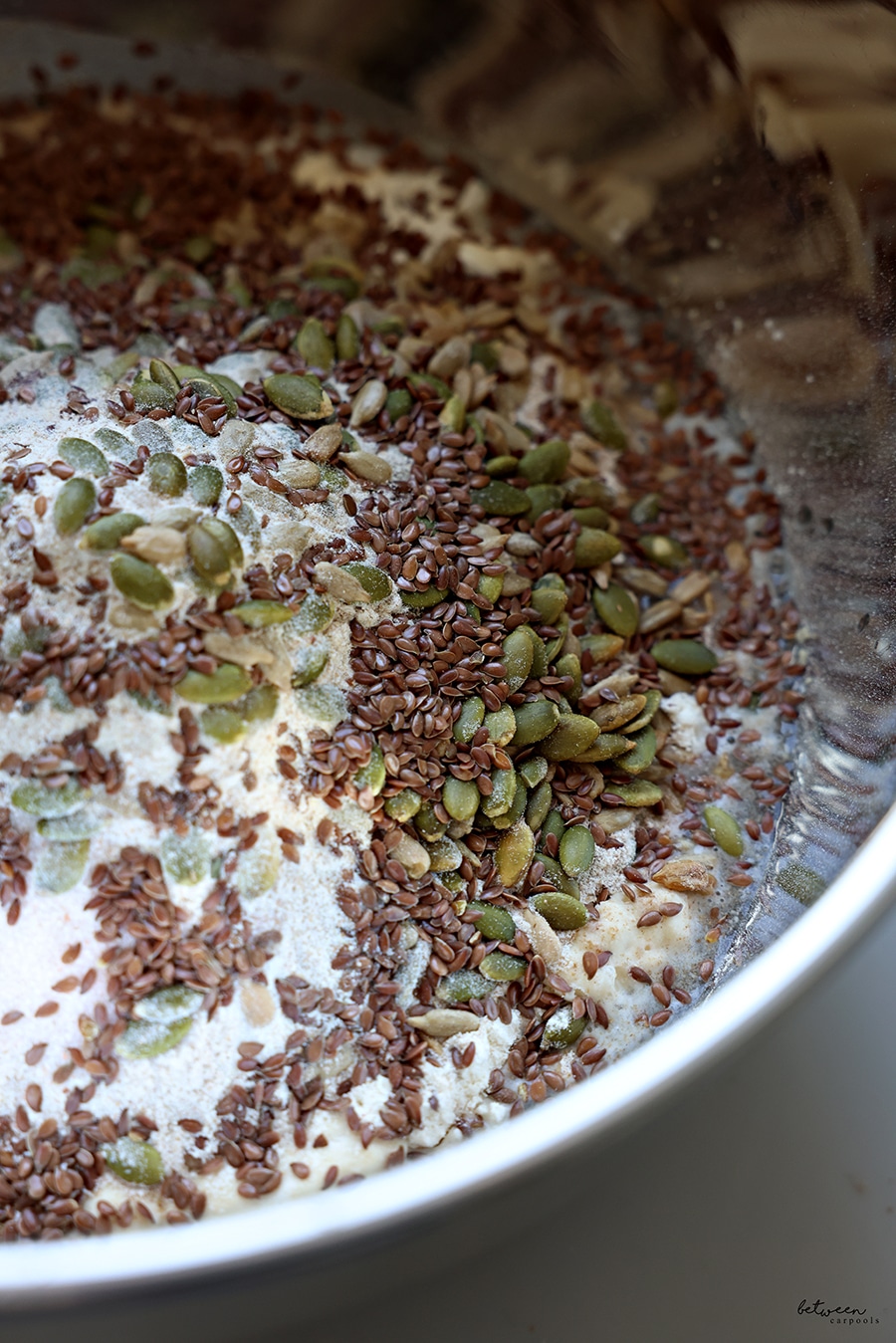 seeds and grains in a metal mixing bowl