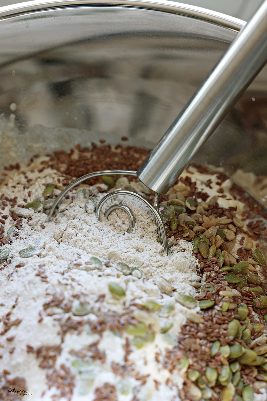 seeds and grains in a metal mixing bowl
