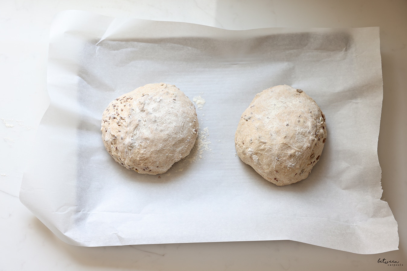 No Knead Artisanal Bread dough formed into two balls