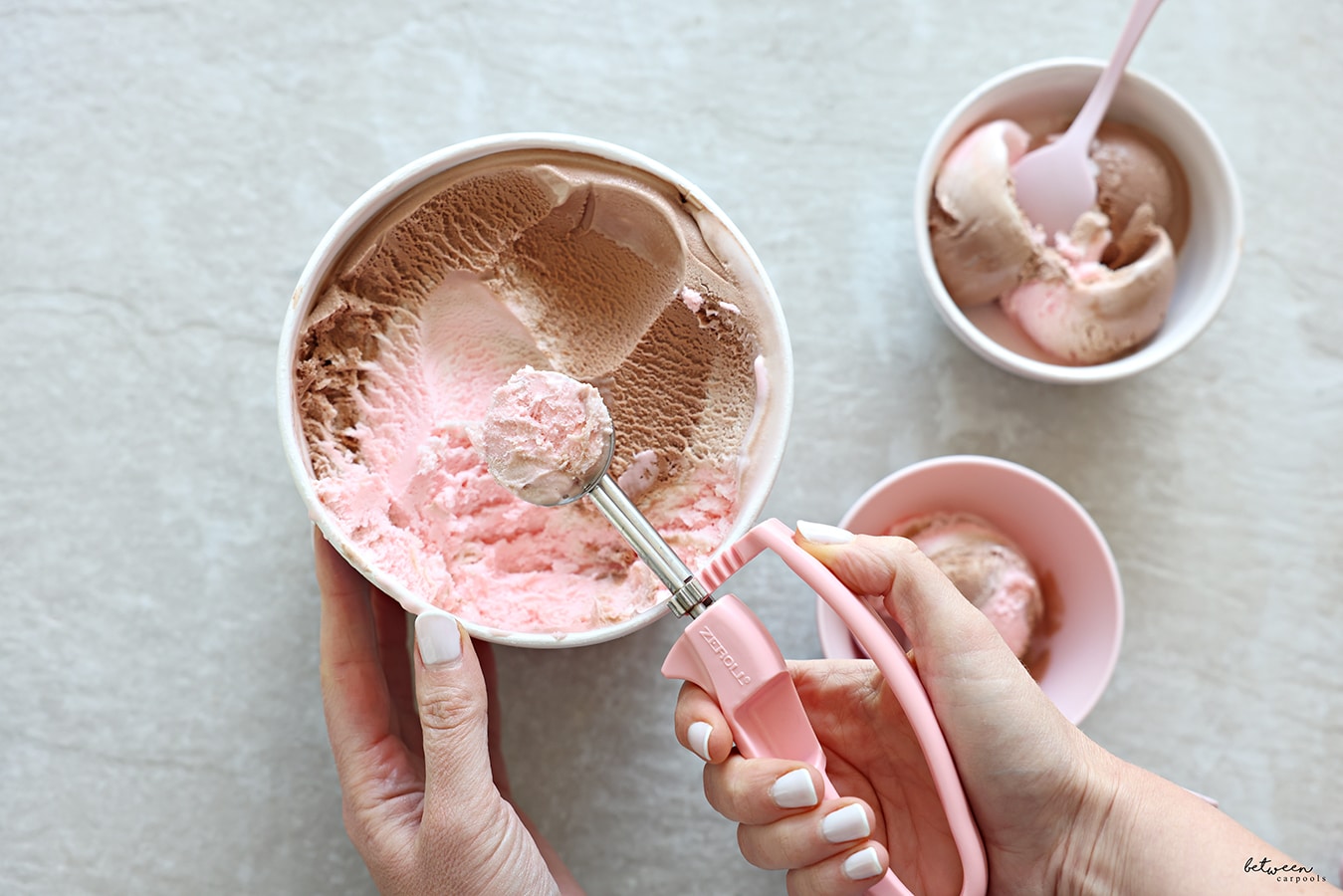 Using the Zeroll EZ Disher to scoop ice cream from the tub