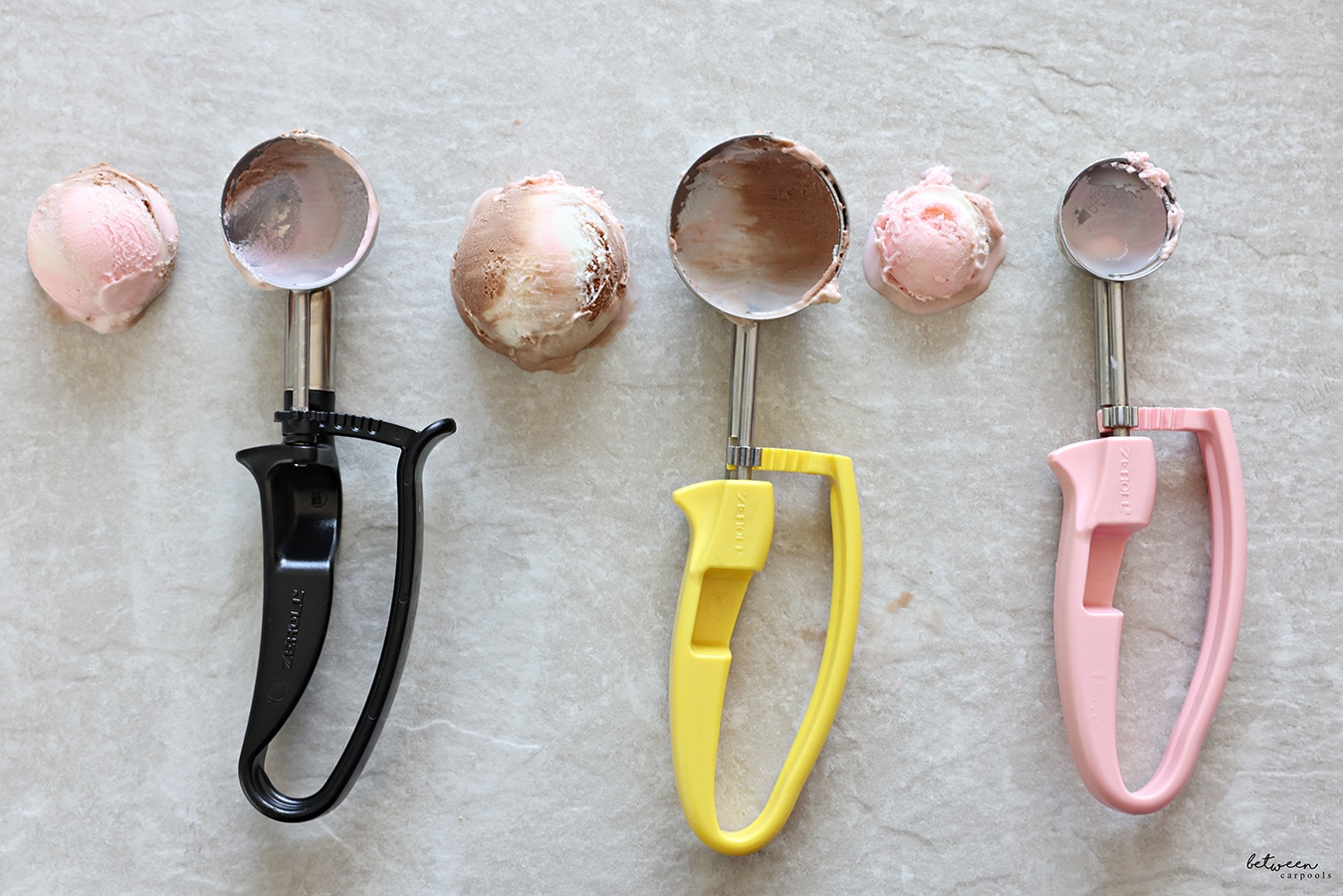 Three colors (Black, Yellow, and Pink) of the Zeroll EZ Disher