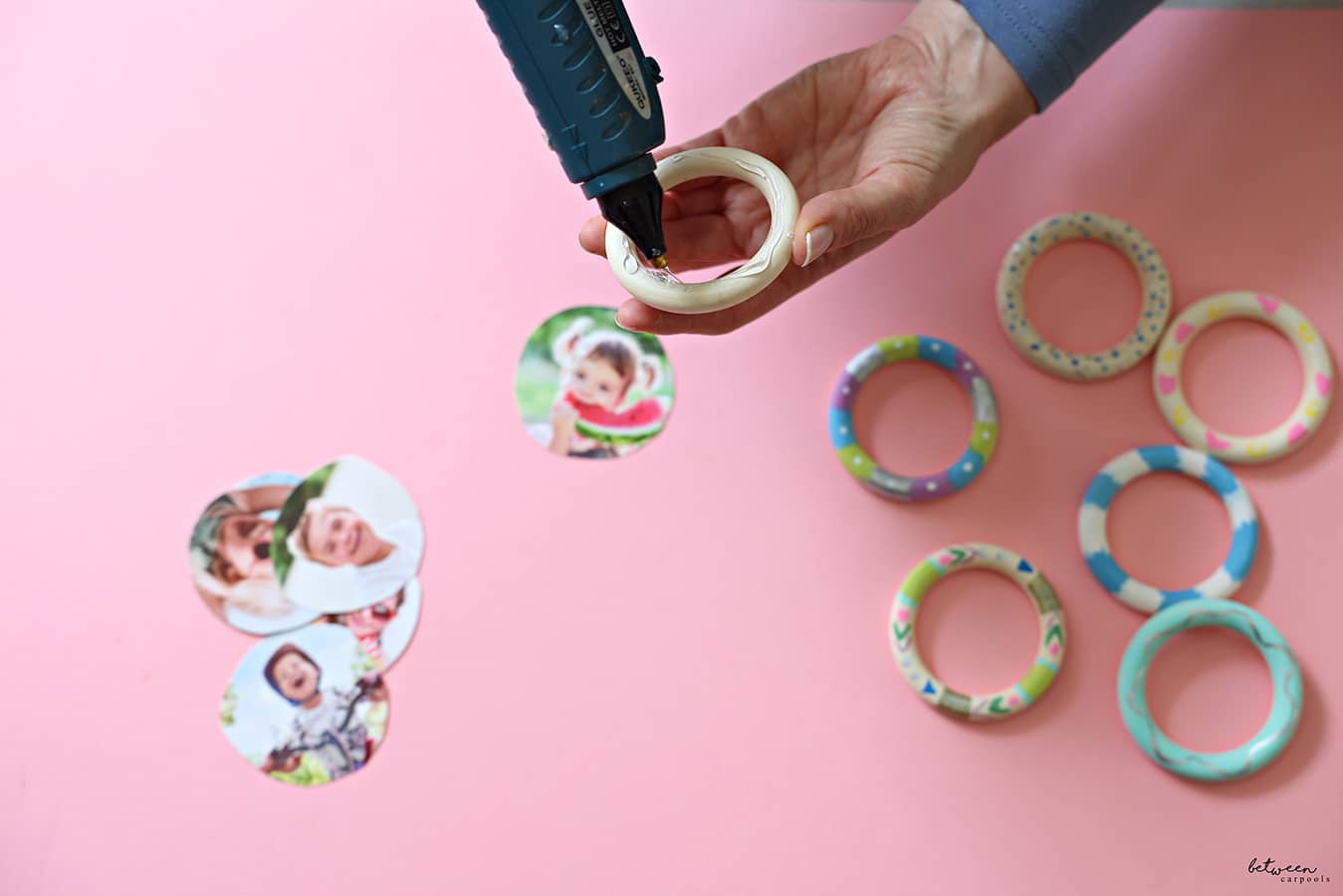glueing the photos onto the rings with a glue gun
