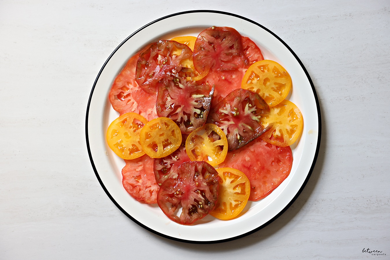 heirloom tomatoes - carpaccio style - on a round plate