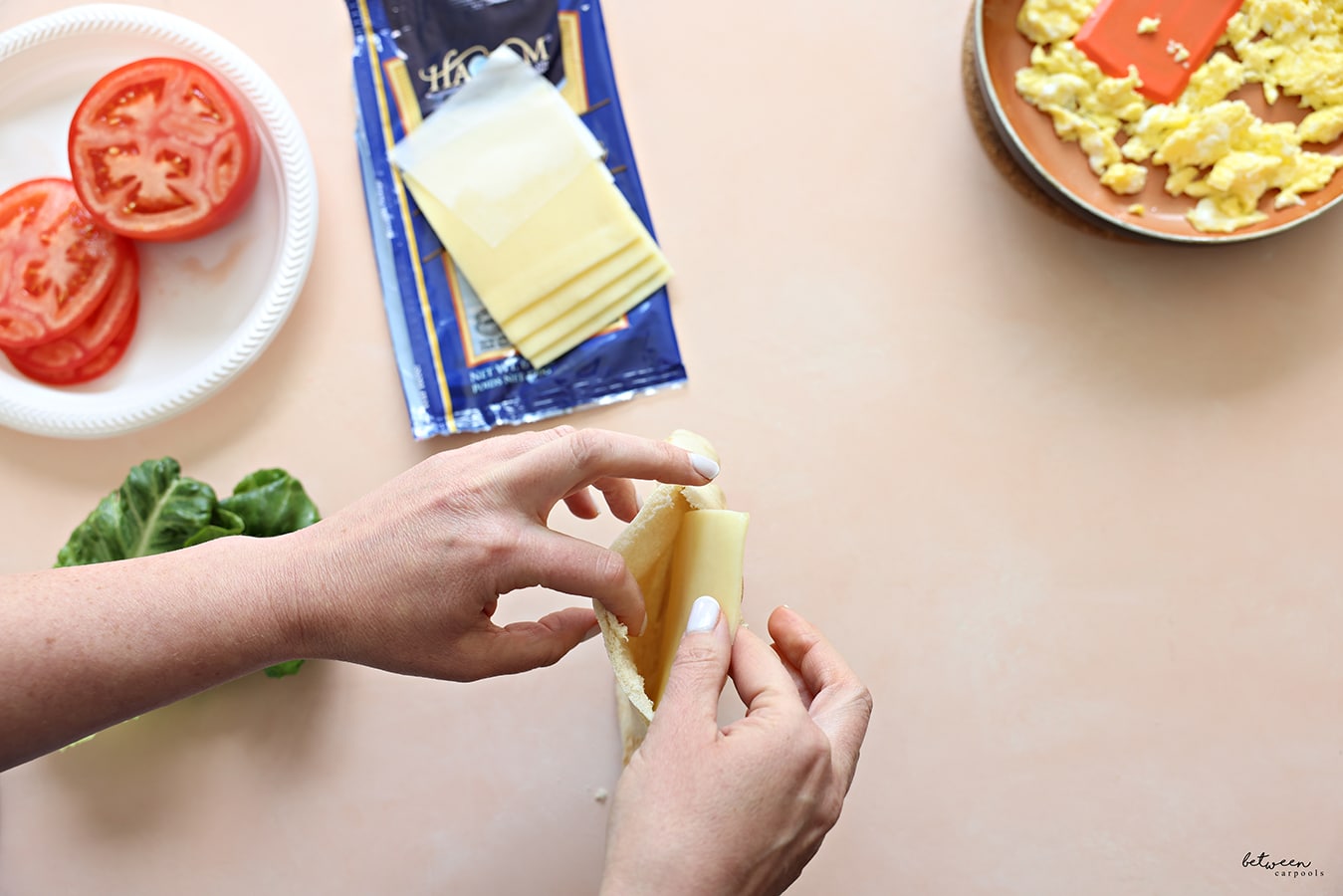 Placing a slice of cheese inside a pita