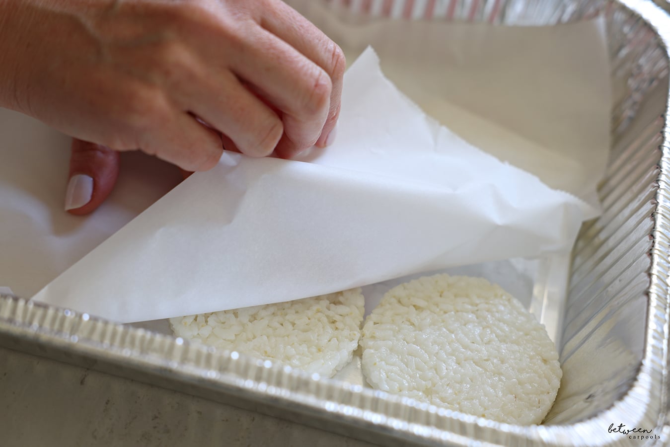 Shaped rice cakes in a 9x13 foil pan.