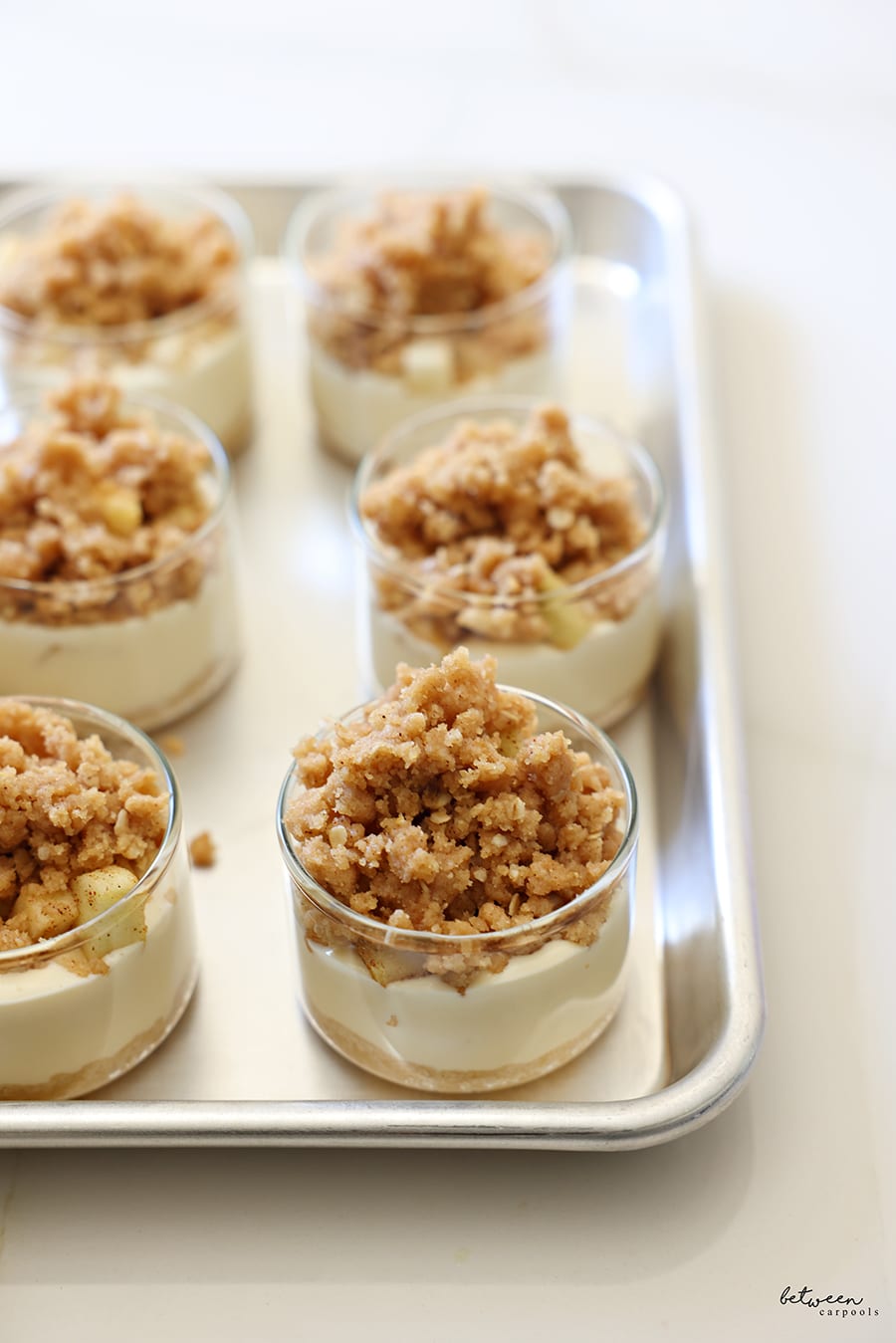 Assembled ramekins on a baking sheet ready to go into the oven.