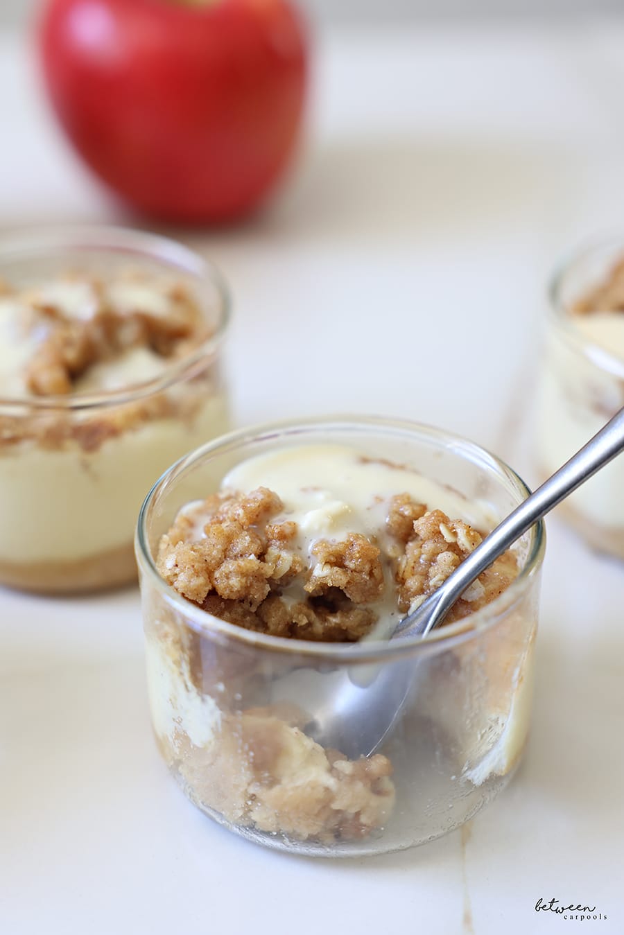Baked apple cheesecake ramekins - a bite out of/a spoon in one