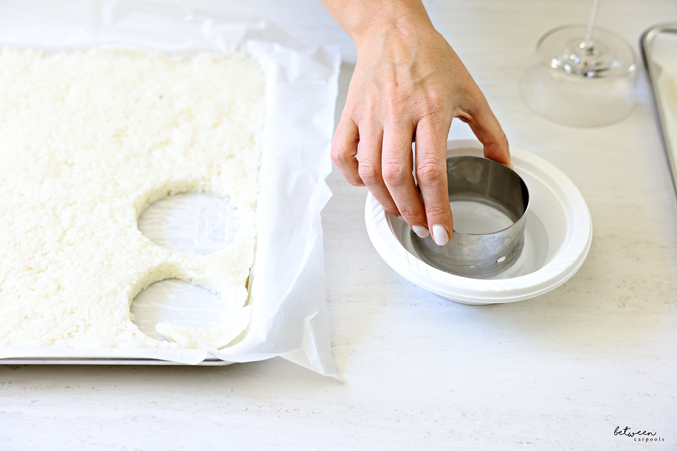 Dipping the deep cookie cutter into water between uses.